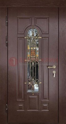 Темная железная дверь со стеклом и ковкой для частного дома ДСК-156 в Звенигороде